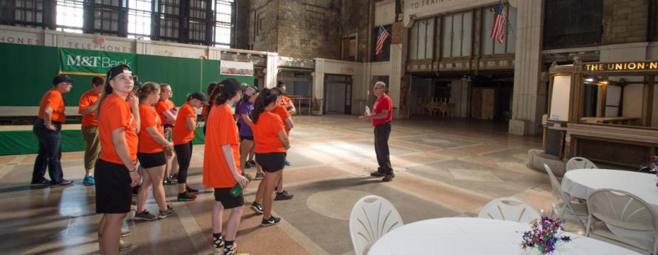 Students take instruction at the Buffalo Central Terminal which they are going to clean